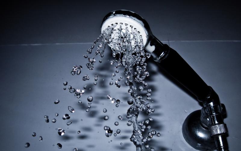 Water spraying from a handheld shower head